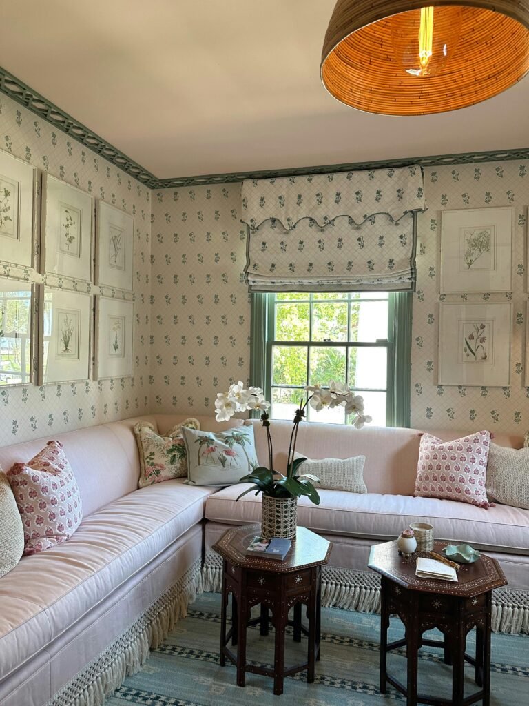 Charming vintage-style living room featuring floral patterns, pastel colors, and elegant decor.